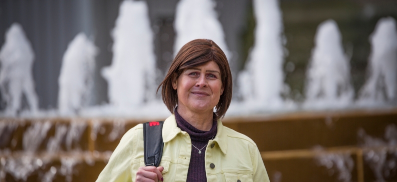 smiling person with bag
