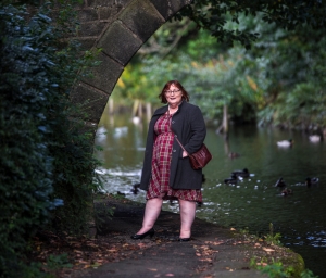 smiling person by canal