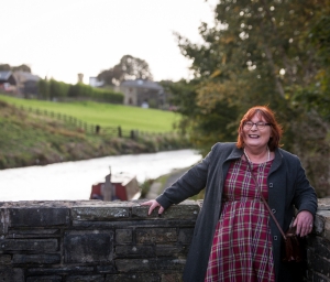smiling person near canal