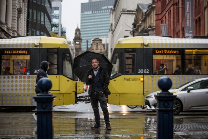 man with umbrella in Manchester